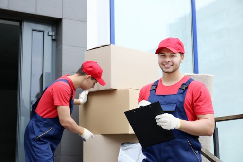 Removal team sorting recyclable packing materials in Finchley
