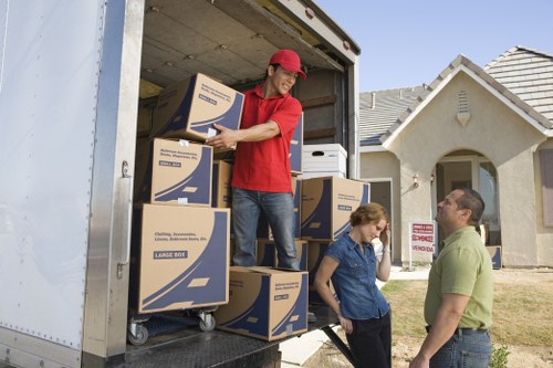 Careful loading of furniture into a moving van in Finchley